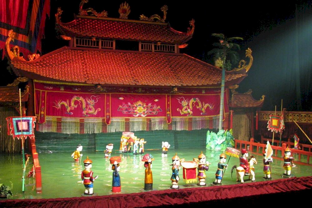 An intricately crafted stage featuring a water-filled arena for Hanoi’s renowned water puppet performances